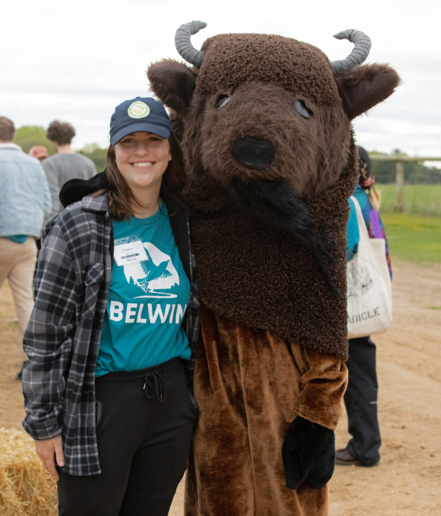 A Belwin staff member smiles for a photo with a friend in a bison costume.
