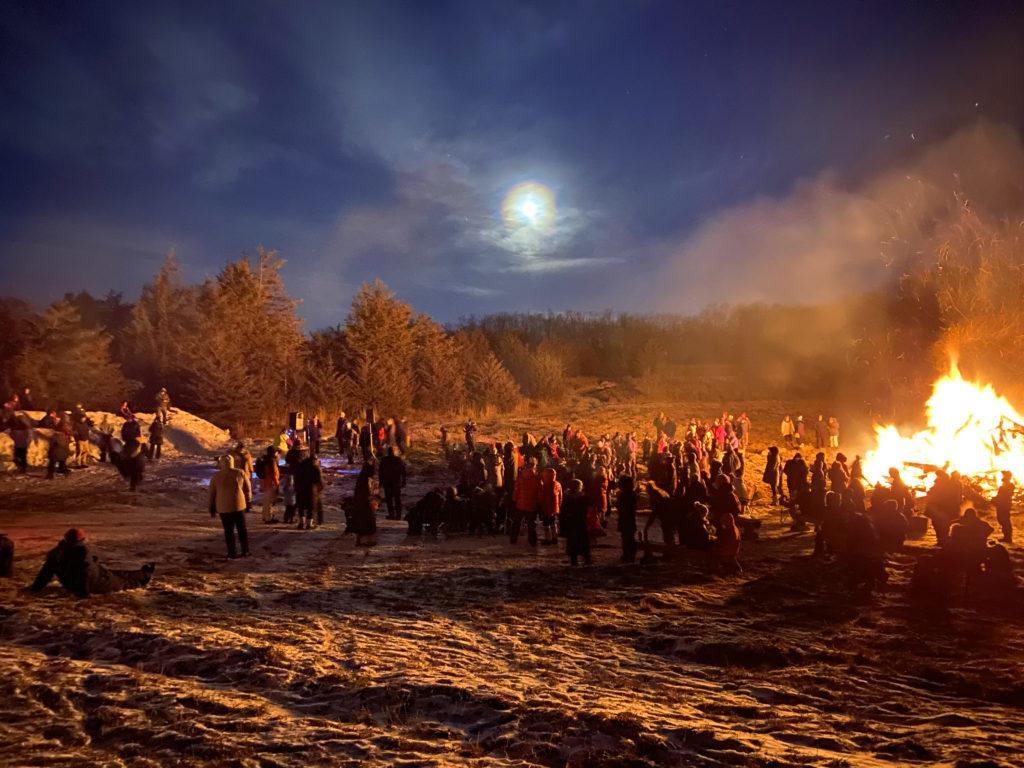 People gathered around bonfire
